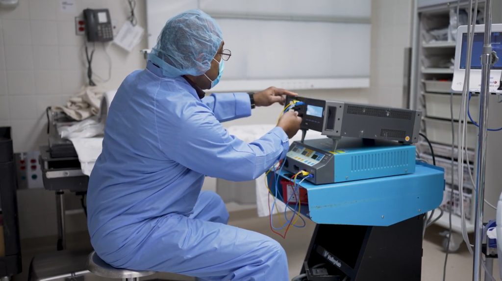 a man using technology in a hospital -Terry UMMS biomedical engineer photo